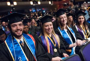 Students sitting at their graduation ceremony. 